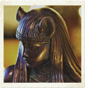Picture of a bronze statue of a cat goddess, presumably Bastet the Egyptian diety. Image by Shane from Pixabay.