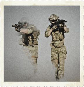 Picture of two soldiers with weapons at the ready walking through a cloud of fog. Image by Pixabay from Pexels.