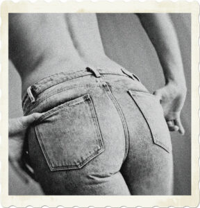 Image focused on the lower backside of a woman, wearing jeans with a bare back visible. Image by Vendula Kociánová from Pixabay.