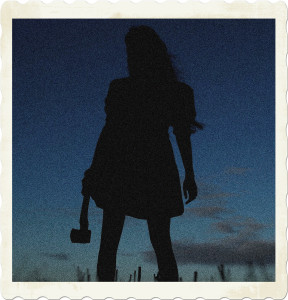 Picture of the silhouette of a woman wearing a dress and carrying an axe. Image by 4657743 on Pixabay.