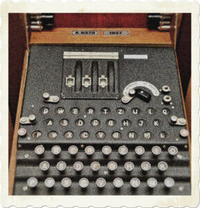 Picture of a Enigma machine fitted with keyboard and display. Image by WikimediaImages from Pixabay.