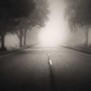 Picture of an empty country road with fog in the distance. Source Pixabay.com.