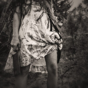 Picture of a girl in a dress carrying a butcher knife. Source Pixabay.com.