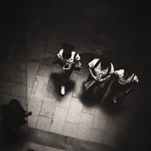 Girls in school uniforms travelling down a hallway. Source Pixabay.com.