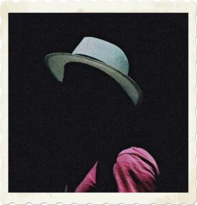 Picture of someone wearing a white hat and red shirt, but with no face visible, concealed by the shadows. Image by Thom Gonzalez from Pexels.