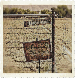 Picture of two rusty signs on a beat up chain link fence indicating no trespassing.  Image by ShonEjai from Pixabay.
