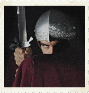 Picture of a roman soldier with a sword and helmet his face concealed by a red cloak. Image by Gerson Martinez from Pixabay.