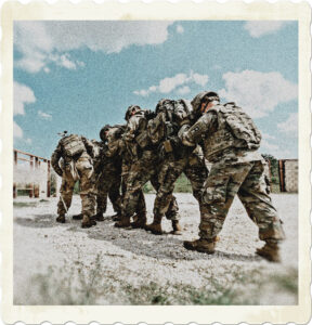 Picture of several soldiers in combat gear, close together in single file. Heading into an area taking fire. Picture by Art Guzman from Pexels.