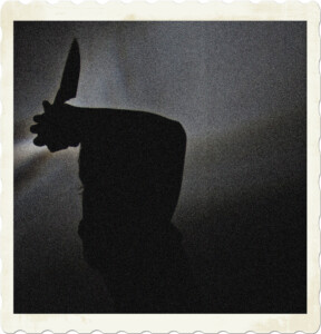 Picture of a silhouette holding a knife above their head with both hands; presumably to stab someone. Image by Niek Verlaan from Pixabay.