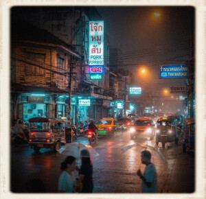 A busy street in Bangkok at night, illuminated by glowing vertical neon signs in Thai and English—including text for "Pork Porridge," "Pharmacy," and "Thai Massage." A thick, hazy orange fog hangs over the road, catching the warm light of overhead streetlamps, while storefronts project a distinct cyan glow across the wet pavement. Tuk-tuks, taxis with headlights cutting through the mist, and motorbikes navigate the damp asphalt, while pedestrians carrying clear umbrellas walk in the foreground. The image has a heavy film grain, softened details, and organic color bleeding, bordered by a square, weathered instant-film frame.