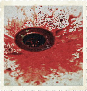Picture focused on a drain, with blood covering and surrounding it. Image by Kawamaru from Pixabay.