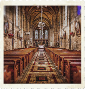 Picture of the inside of a church, ornate with tiles and stonework. Seems to be a naval theme to many of the decorates including the chandalier. Focused on the middle aisle. Image by ddzphoto from Pixabay.