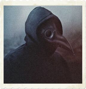 Picture of someone wearing a black hoody, in a dark environment, facing a fire, wearing a plague doctor mask. Image by Martin Bauschke from Pixabay.