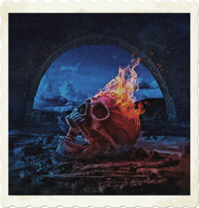 Picture of a skull on fire, with jaw still attached and gaping on a pile of ash.