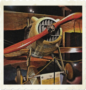 Picture of a Spad VII fighter plane as seen from the front. Focused on the propeller blades, with both wings in view. Image by Elisa Emiliani from Pixabay.