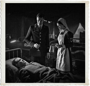 Highly detailed cinematic scene set in a dimly lit canvas ward tent of a British Casualty Clearing Station during the Great War in 1915. A distinguished British Colonel stands at the bedside of a wounded soldier, holding an empty glass of water in one hand while speaking quietly to a young Canadian Bluebird nurse. The nurse is a brunette with striking steel-grey eyes that have a lively glow and a mischievous grin on her face. She wears the standard dark blue uniform dress with white apron and starched white veil of the Canadian Nursing Sisters. She is holding a gleaming stainless-steel pitcher, standing close to the Colonel. The Colonel has a subtle vampiric elegance — sharp aristocratic features, pale skin, and has just discreetly smeared a single drop of his own blood into the bottom of the glass using a talon on his thumb in a lightning-fast sleight-of-hand motion enhanced by vampiric speed, the drop barely visible at the bottom of the glass. Soft lamplight illuminates the intimate interaction, creating dramatic shadows across the scene. Background shows rows of cots with wounded soldiers, medical equipment, faint blood stains on bandages, and the muddy, war-torn atmosphere outside the tent flaps. Moody atmospheric lighting, historical accuracy mixed with subtle supernatural tension, realistic yet slightly stylized, cinematic composition focused on the Colonel and the nurse at the patient's bedside. Clothing and settings appropriate for 1915.