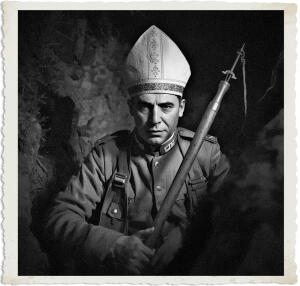stern man dressed in a military uniform and a tall white papal mitre (bishop's hat) stands in a dark, rocky setting, holding a large rifle with a bayonet. He gazes directly forward with a serious expression. The image is in dramatic black-and-white with a vintage aged photo border.