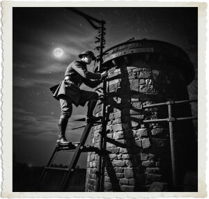 a cinematic photo of a British officer with a determined expression, wearing a trench coat and helmet, climbing up a weathered old railway water tower with rusty ladders and worn stone walls, set against a dark nighttime sky with stars and a full moon, the scene and clothing appropriate for 1915 during The Great War, with the officer's face illuminated by the faint light of a nearby lantern, casting long shadows across the tower's surface, photographed in a dramatic and moody style with deep shadows and highlights, emphasizing the officer's bravery and the perils of war.