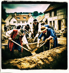 People from the town busy digging a trench. Scene and clothing appropriate for 16th century France.