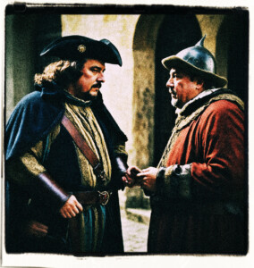 The corpulent count talking to an guard. Clothes and style appropriate for 16th century France.