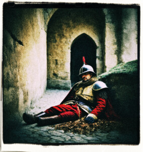 Picture if a dead castle guard as the resulting of falling off the wall. Clothes and background appropriate for 16th century France.