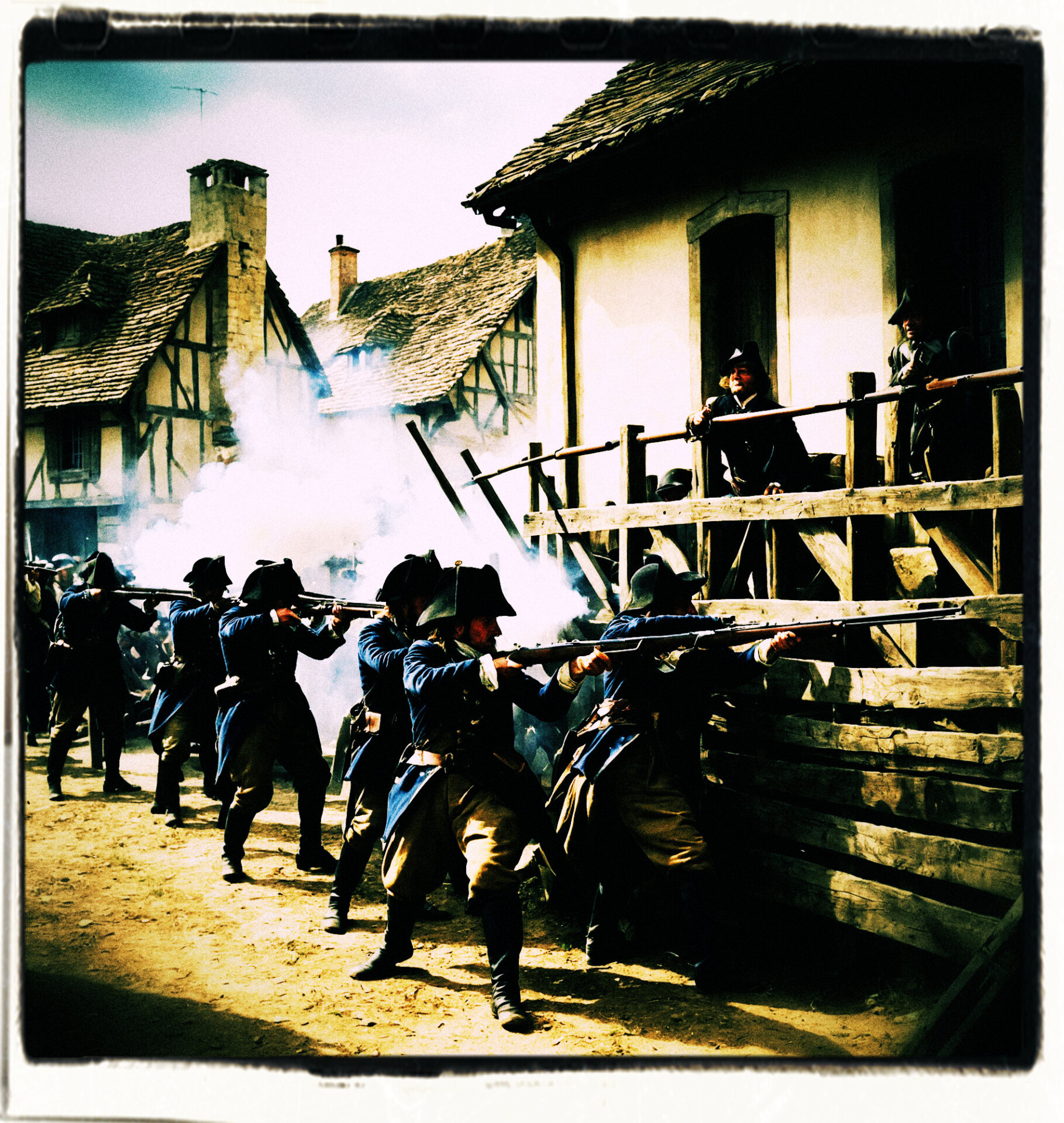 Soldiers firing muskets from behind a barricade in a small town. Background and clothing appropriate to the 16th Century France.